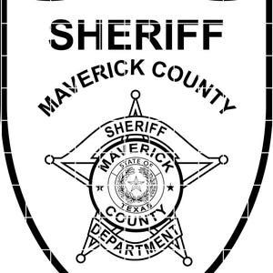 May include: Black and white Sheriff badge featuring the words "SHERIFF" and "MAVERICK COUNTY" in bold, uppercase letters. The badge includes a star-shaped emblem with the words "SHERIFF MAVERICK COUNTY TEXAS DEPARTMENT" and the abbreviation "TX".