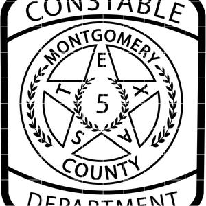 May include: Black and white Constable Montgomery County Department badge. The design features a star in the center, surrounded by a wreath, with text including "Constable", "Montgomery", "County", and "Department".