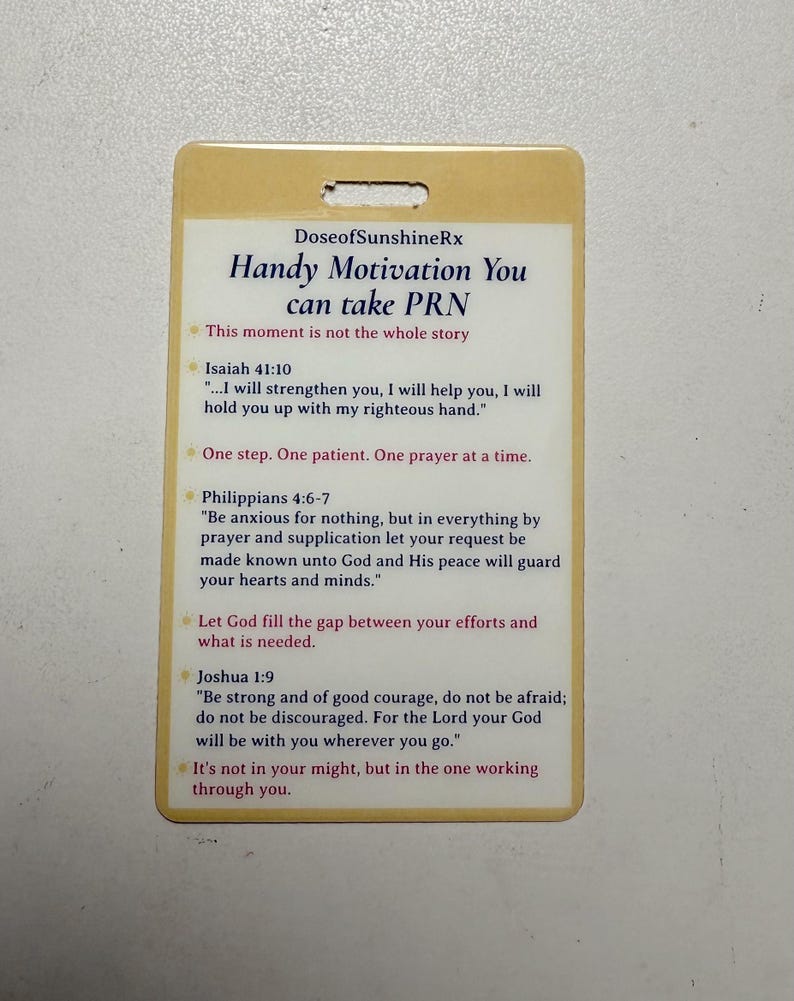 May include: A cream-coloured rectangular card with rounded corners. The card features the text "DoseofSunshineRx" and "Handy Motivation You can take PRN." Several inspirational quotes are printed on the card, including verses from Isaiah, Philippians, and Joshua.