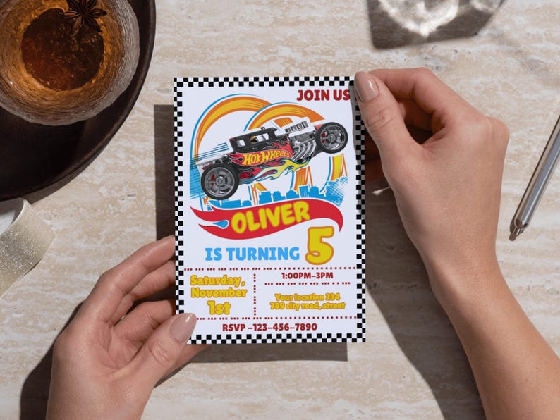May include: A birthday invitation featuring a Hot Wheels car design. The invitation reads "OLIVER IS TURNING 5" with event details. The design includes a checkered border and a stylized car graphic.