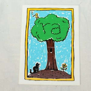 May include: A yellow bird sits on a branch of a green tree with a brown trunk. A black cat sits on the ground below the tree. A yellow flower grows near the base of the tree. The image is framed in a yellow border.