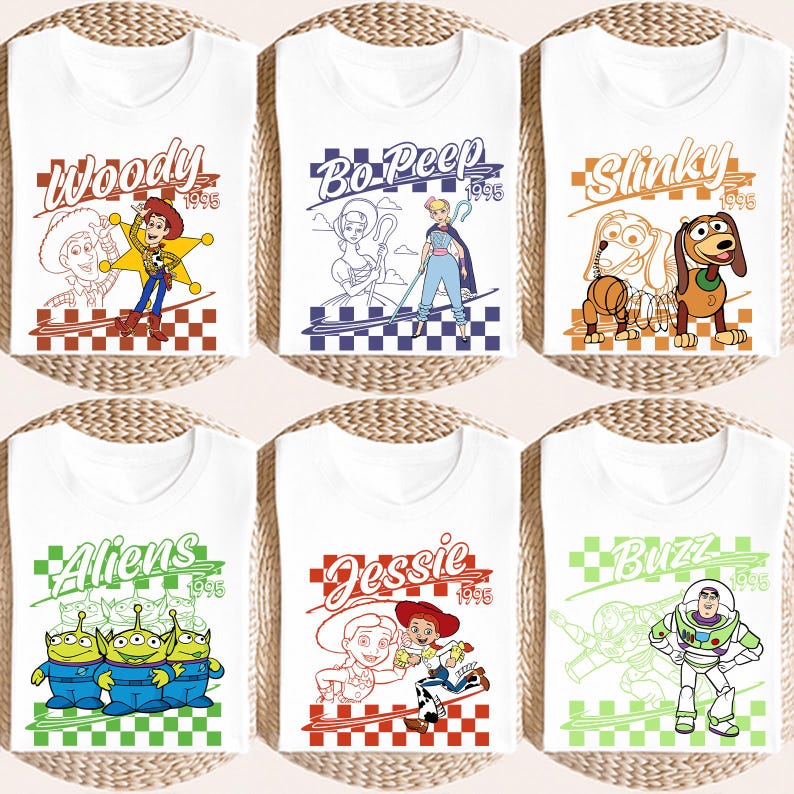 May include: White t-shirts featuring various characters from the animated film Toy Story. Each shirt displays a character's name and the year 1995, with designs including Woody, Bo-Peep, Slinky, Aliens, Jessie, and Buzz Lightyear.