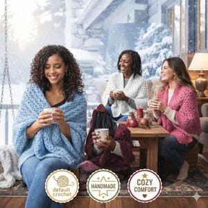 May include: Three people are shown enjoying warm drinks while wearing handmade crochet shawls in blue, white, and pink. The scene is set indoors with a snowy outdoor backdrop. The image includes three circular badges with the text "default crochet", "handmade", and "cozy comfort".