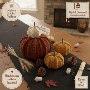May include: A collection of handmade crochet pumpkins in various sizes and colors, including rust, mustard, and cream. The pumpkins are arranged on a black runner with decorative elements like pinecones and acorns. The image includes text that says "Beginner Crochet Pattern" and "Happy Thanksgiving".