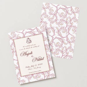 May include: Two wedding invitation cards with a floral pattern in pink and beige on a white background. The front card has text that reads "Anjali & Nikhil" and the date "Friday, July 15, 2026". The cards are for a wedding.