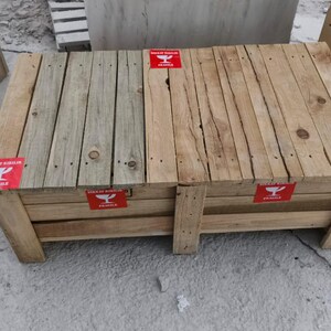 May include: Wooden crates with a rustic appearance. The crates are made of light-colored wood and feature red "Fragile" labels. The design includes visible wood grain and nail heads, suggesting a handmade construction. The crates are suitable for storage or display.
