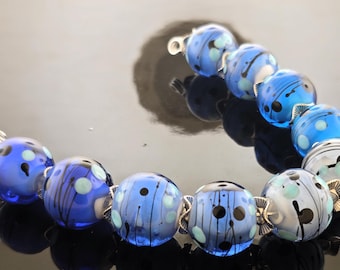 Handmade Lampwork Bead Set: White core Encased in Blue Shades decorated with Turquoise and white drizzle Beads