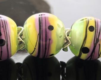 Handmade Lampwork Beads Set: White Heart encased in Light Green decorated with Yellow and Purple Rose Stringer and Black Detail