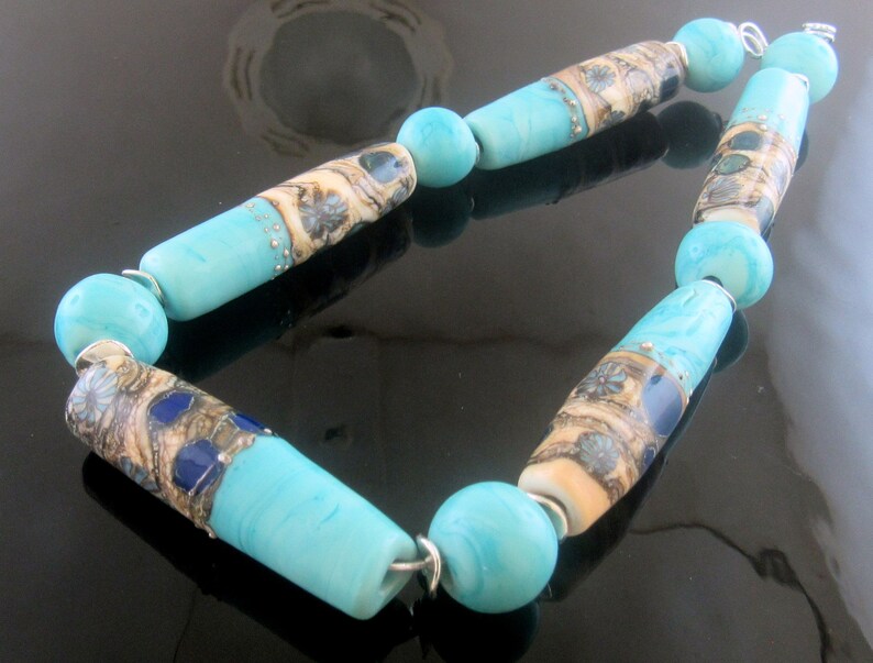 5 Organic tube beads decorated with lots of silver glass applications with coordinating spacers