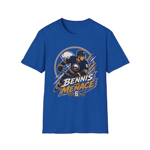 May include: Royal blue t-shirt featuring a hockey player graphic. The design includes a hockey player in a dark blue uniform with the text "Bennis the Menace 6" in white and yellow. The shirt is a crew neck.