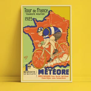 May include: Vintage poster for the 1925 Tour de France, featuring a cyclist on a bicycle. The poster has a red, green, and yellow color scheme with the text "Tour de France" and "Météore". The poster is framed.