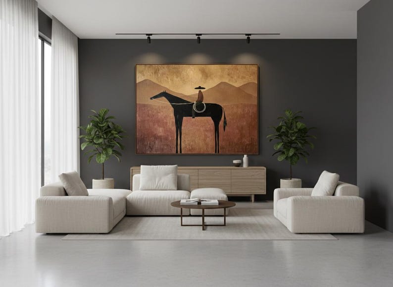 May include: Living room with a large abstract painting of a horse and rider. The room features a light-colored sectional sofa, a wooden cabinet, and two potted plants. A round coffee table sits on a light-colored rug.