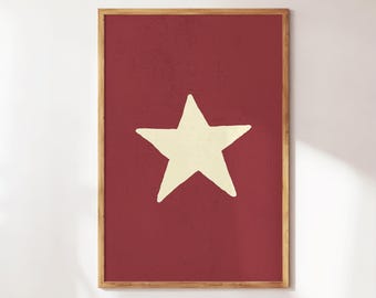 Può includere: Stampa artistica incorniciata con una grande stella bianco sporco centrata su uno sfondo rosso intenso strutturato. L'opera d'arte è racchiusa in una cornice di legno naturale, creando un'estetica rustica. Adatto per l'arredamento della casa.