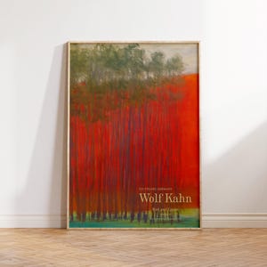 May include: Framed art print featuring a vibrant abstract landscape. The artwork showcases vertical red strokes against a bright red background, with green and gray at the top and a green base. The print includes the text "STUTTGART GERMANY WOLF KAHN Red and Green."