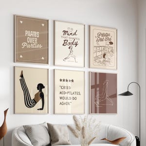May include: A collection of six framed art prints with Pilates-themed designs. The prints feature text like "Pilates Over Parties" and "It is the Mind that Shapes the Body." The color palette includes beige, brown, and black, with minimalist illustrations of Pilates poses.