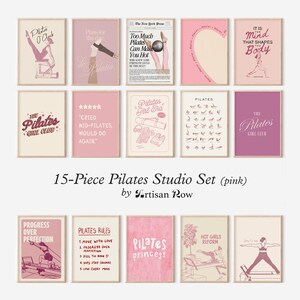 May include: A 15-piece Pilates studio set featuring pink-themed art prints. The prints showcase Pilates-related illustrations and text, including phrases like "Pilates O'Clock," "Pilates Girl Era," and "Hot Girls Reform." The set is designed by Artisan Row.