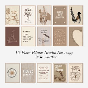 May include: A 15-piece Pilates studio set in beige, featuring framed art prints with Pilates-themed illustrations and quotes. The set includes images of exercises, text like "Pilates O'Clock", and the phrase "Hot Girls Reform".