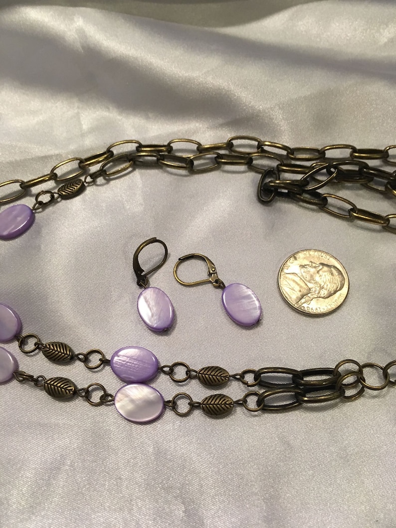 Flower necklace with purple shells earrings