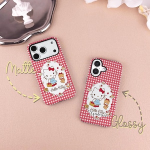 May include: Two phone cases with a red and white checkered pattern. Each case features a Hello Kitty design with a bow, dress, and teddy bear. One case is labeled "Matte" and the other "Glossy".