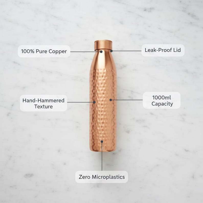 May include: A copper water bottle with a hand-hammered texture. The bottle has a leak-proof lid and a 1000ml capacity. It is made of 100% pure copper and is free of microplastics.
