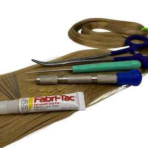 May include: A collection of hair extension tools and supplies, including scissors, a needle tool, a glue tube, and small rubber bands. The tools have blue, green, and silver handles. The glue tube reads "Fabri-Tac".