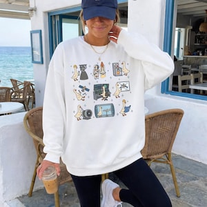 Op de afbeelding: Een set van drie keramische mokken met een gespikkelde, matte afwerking. De mokken zijn in tinten crème, lichtgrijs en donkergrijs. Elke mok heeft een eenvoudig, minimalistisch ontwerp, ideaal voor koffie of thee.