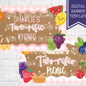 May include: Digital banner template with a brown background and pink gingham border. The banner features the text "Charlie's Two-rific Picnic" with illustrations of smiling fruits like oranges, strawberries, and watermelon.
