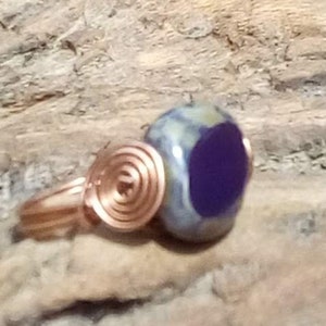 Antique copper wire wrapped ring with a handcrafted Purple Yam Czech Picasso Window Pebble Glass Bead