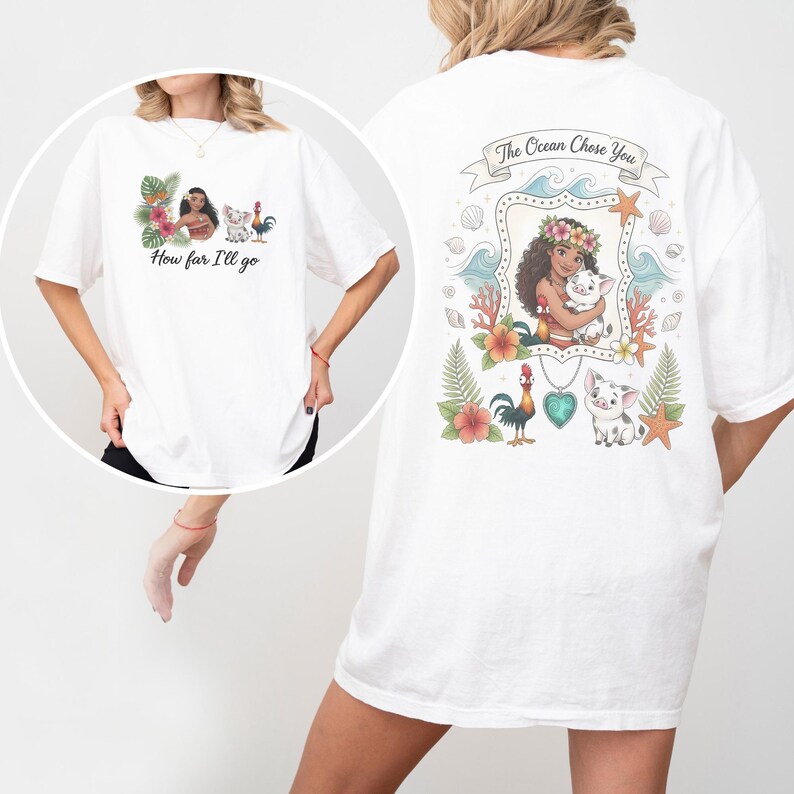 May include: White t-shirt with a vibrant graphic inspired by an animated film. The front features the text "How far I'll go" and character illustrations. The back displays the text "The Ocean Chose You" with a framed character illustration and other graphics.