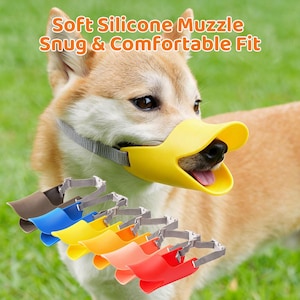 May include: A dog wearing a yellow duck-bill shaped silicone muzzle with a grey adjustable strap. Below, a row of six additional muzzles in brown, blue, yellow, orange, pink, and red are displayed, each featuring a grey strap and buckle.