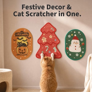 May include: Three wall-mounted cat scratchers with festive designs. The left is an oval orange Halloween pumpkin with a black cat. The centre is a red Christmas tree with gingerbread men. The right is an oval green snowman with snowflakes.