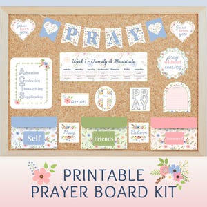May include: A cork notice board displaying a printable prayer board kit with floral motifs. The kit includes a PRAY banner, a Week 1 Family & Gratitude chart, ACTS cards, and labelled envelopes for Self, Friends, and Answered prayers with various religious text.