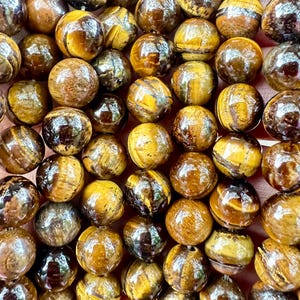 Tiger&#39;s Eye Gemstone Beads: Golden Brown Crystal, 8mm Strand