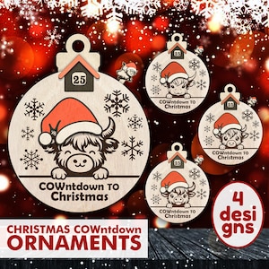 May include: Wooden Christmas ornaments with a cow wearing a Santa hat and the text "COWntdown TO Christmas." Each ornament has a small house with the number 25. The ornaments are round and have snowflake designs.