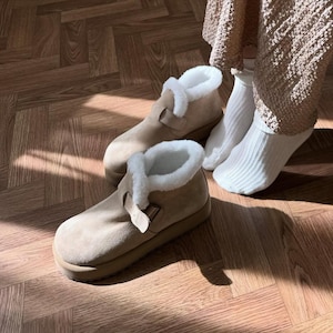 Winter suede boots with natural fur lining, shown indoors with cozy outfit, handmade shoes for women