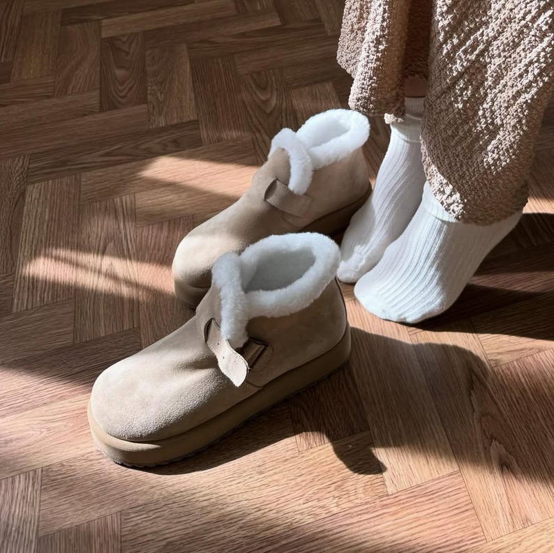 Winter suede boots with natural fur lining, shown indoors with cozy outfit, handmade shoes for women
