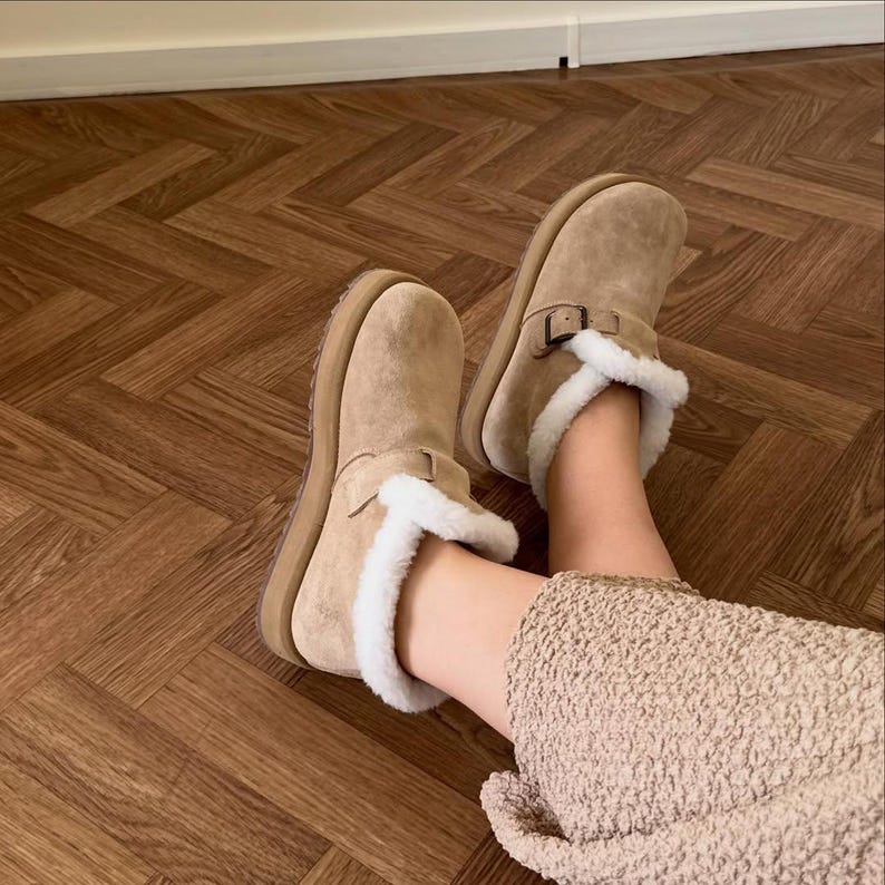Women wearing warm suede ankle boots with fur lining and anatomical sole, handmade winter shoes