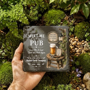 May include: A square slate plaque featuring the text MEET ME AT THE PUB, Save Me A Seat Until We Meet Again, IN LOVING MEMORY OF Michael David Thompson 1950-2025, with an illustration of a beer mug on a wooden stool and a hanging lantern.