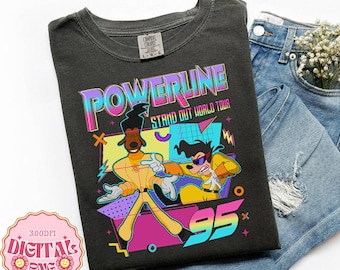 May include: Dark gray t-shirt featuring a colorful graphic of the Powerline Stand Out World Tour '95. The design includes cartoon characters in yellow outfits and the text "POWERLINE" in a vibrant, multi-colored font. The shirt is paired with blue denim jeans.