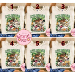 May include: A white ceramic mug with a black handle and the text "But First, Coffee" in a bold, black font. The mug is set against a blurred background, highlighting its clean design.