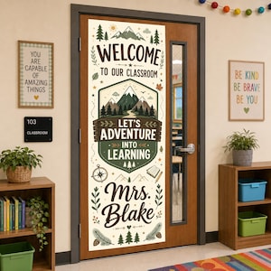 May include: A vertical classroom door banner featuring a mountain landscape illustration with the text Welcome to our classroom, Let's adventure into learning, and Mrs. Blake. The design includes pine trees, a compass, a book, and a pencil.
