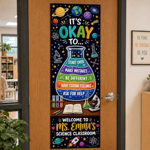 May include: A vertical science classroom door sign with a black background featuring space elements, a large colorful laboratory flask, and the text: IT'S OKAY TO... START OVER, MAKE MISTAKES, BE DIFFERENT, HAVE STRONG FEELINGS, ASK FOR HELP. WELCOME TO MS. EMMA'S SCIENCE CLASSROOM.