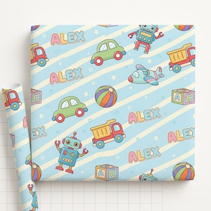 May include: A roll of light blue wrapping paper with a repeating pattern of colorful toy illustrations, including cars, robots, and airplanes. The name "ALEX" is also featured throughout the design.