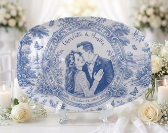 May include: A blue and white ceramic platter with a personalized wedding photo. The oval-shaped platter features a blue toile design with butterflies and a central portrait of a couple, with the names "Charlotte & Martin" and the date "October 22, 2025".
