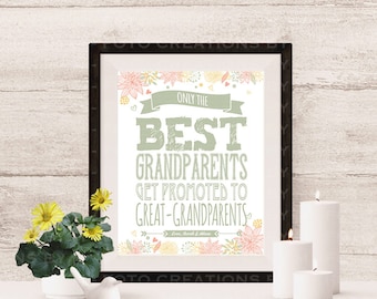 May include: A framed print with the text "ONLY THE BEST GRANDPARENTS GET PROMOTED TO GREAT-GRANDPARENTS." The print is decorated with floral accents and is displayed on a white surface with candles and a small plant.