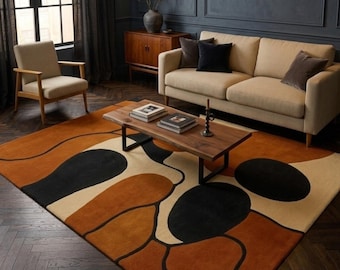 Tapete neozelandês de lã tufado à mão | Estilo geométrico de meados do século XX, preto, creme e laranja.