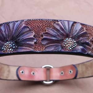 Purple floral design for this handmade dog tag collar. The flowers are hand tooled for a ever lasting design. it fits 18.25" over the head size by 1" wide.