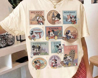Comfort color Mickey & Friends Disney Epcot Shirt, Epcot World Tour 2026, Disneyland Family Vacation, Snacks Drinking Around The World Shirt