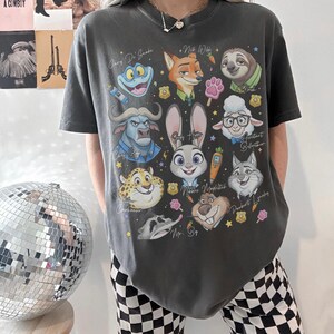 May include: A set of three ceramic mugs with a speckled, matte finish. The mugs are in shades of cream, light gray, and dark gray. Each mug has a simple, minimalist design and a rounded handle.