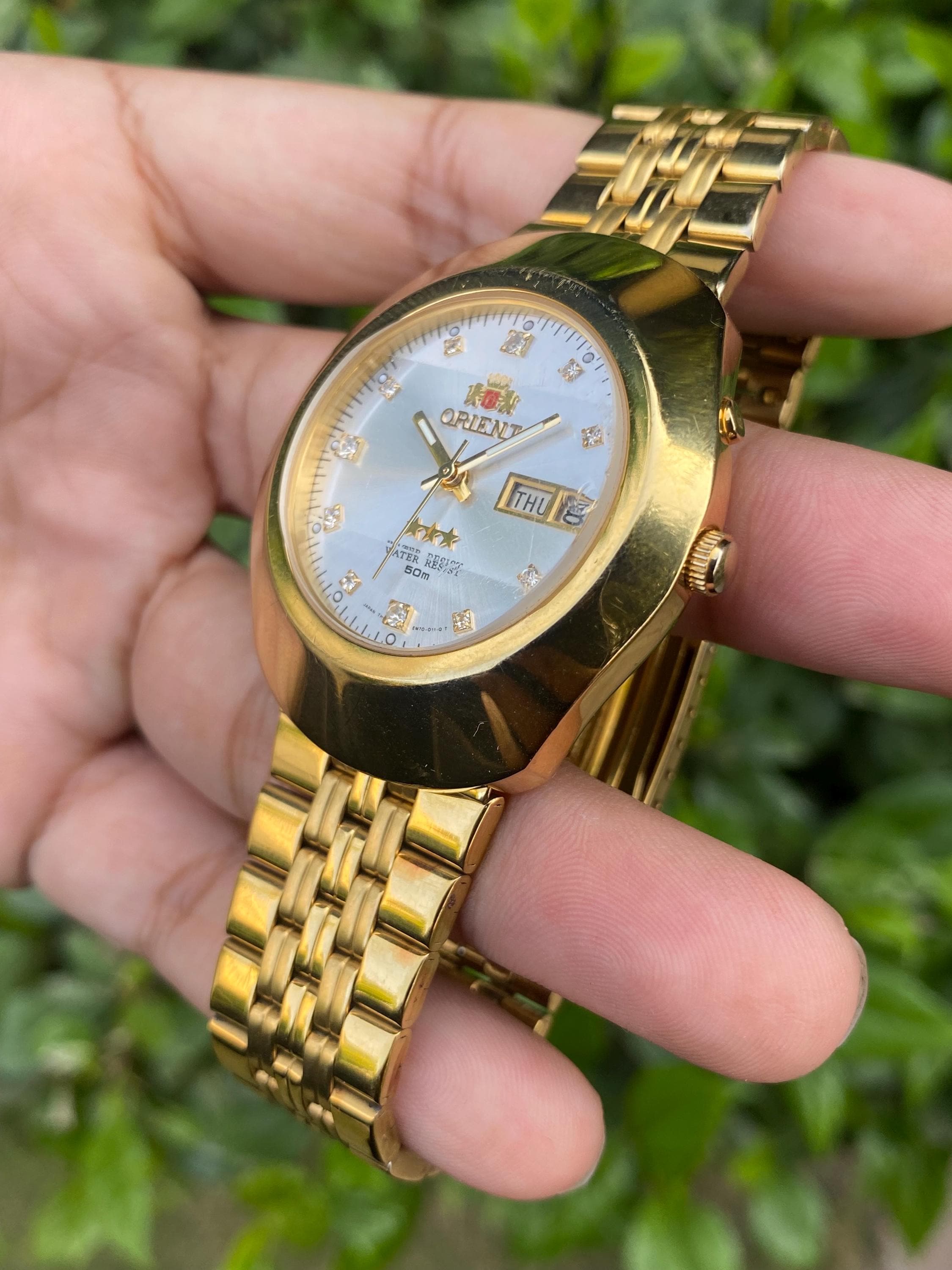 All Authentic Orient 3 Star Automatic EM70-A0-B CA Day/date Gold